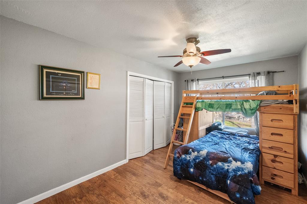 600 Bluff Springs Road Fort Worth, TX 76108 - Photo 18 of 40 a bed room with a bed and a ceiling fan