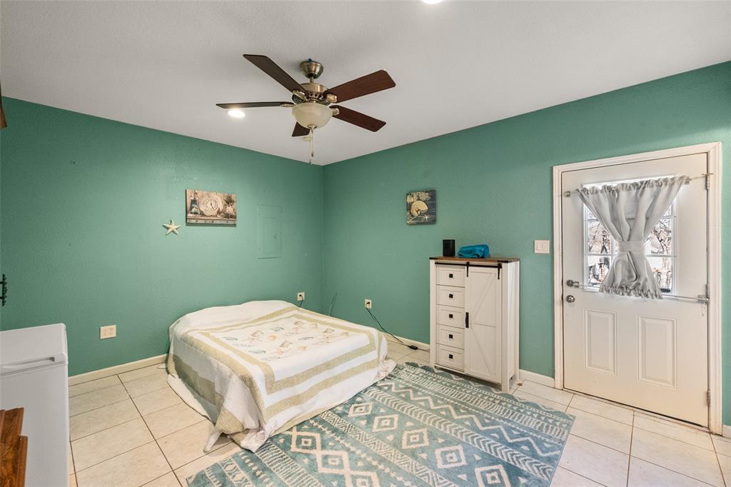 600 Bluff Springs Road Fort Worth, TX 76108 - Photo 21 of 40 a bedroom with a bed and a window