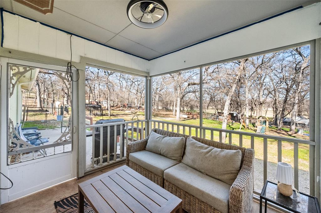 600 Bluff Springs Road Fort Worth, TX 76108 - Photo 28 of 40 a living room with furniture and a floor to ceiling window