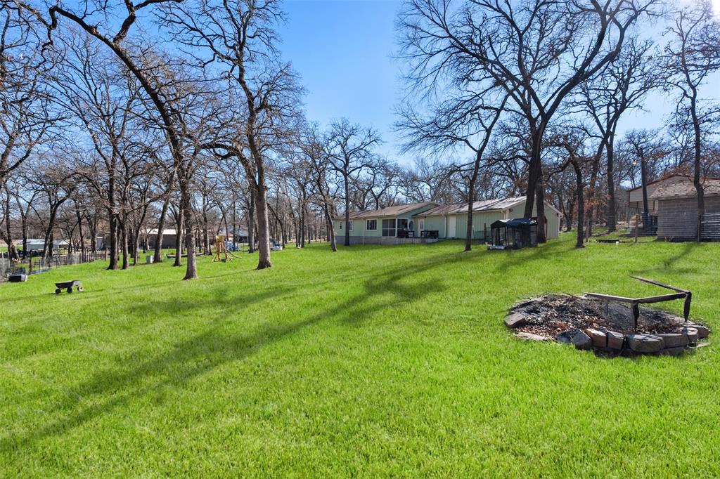 600 Bluff Springs Road Fort Worth, TX 76108 - Photo 29 of 40 a big yard with lots of green space and trees