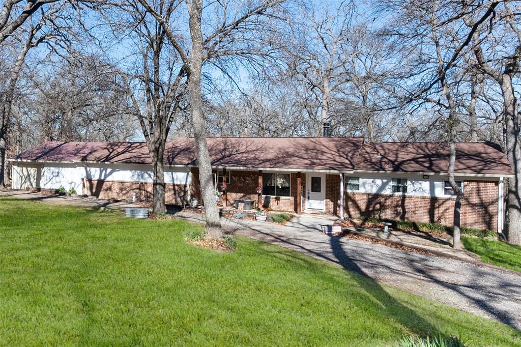 600 Bluff Springs Road Fort Worth, TX 76108 - Photo 33 of 40 a view of a house with backyard and sitting area