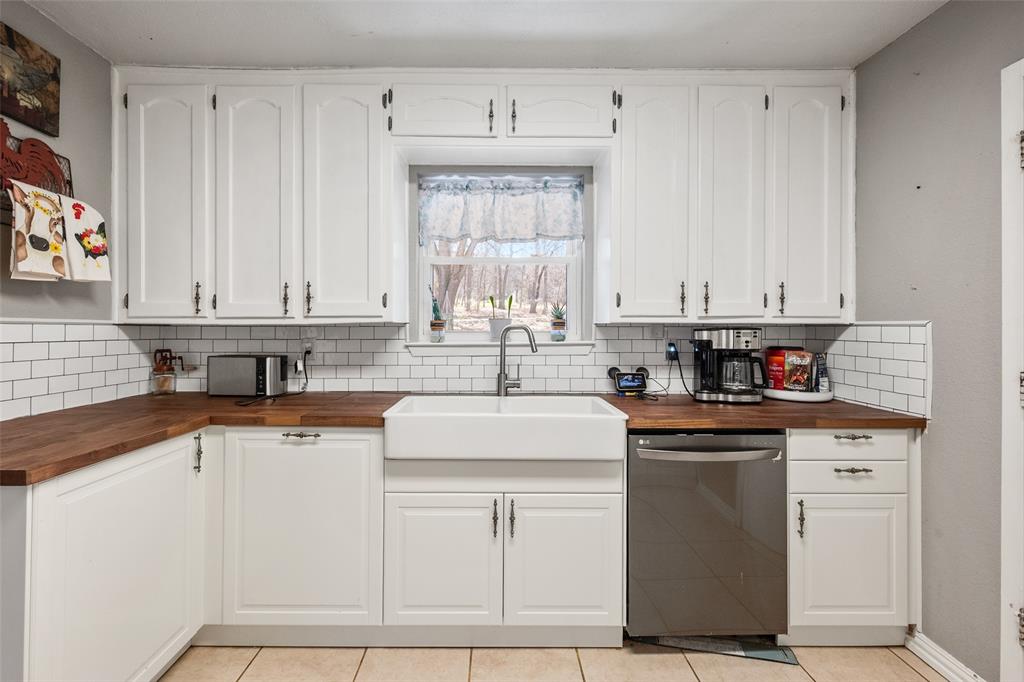 600 Bluff Springs Road Fort Worth, TX 76108 - Photo 5 of 40 a kitchen with appliances cabinets and a sink