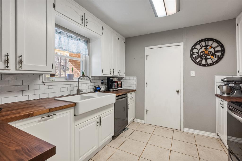 600 Bluff Springs Road Fort Worth, TX 76108 - Photo 8 of 40 a kitchen with a refrigerator and a sink