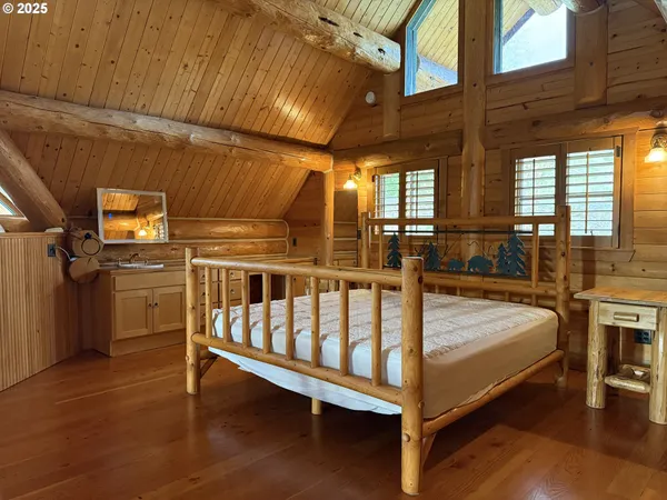 a bed room with a bed and a table