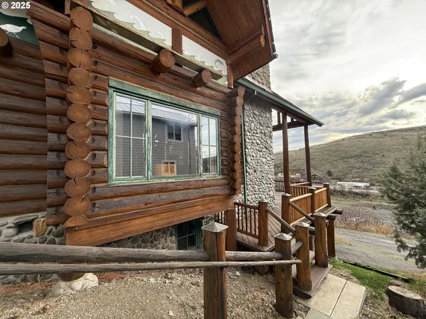 a view of house with outdoor space and seating area