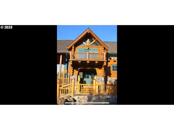 a view of a house with a small yard