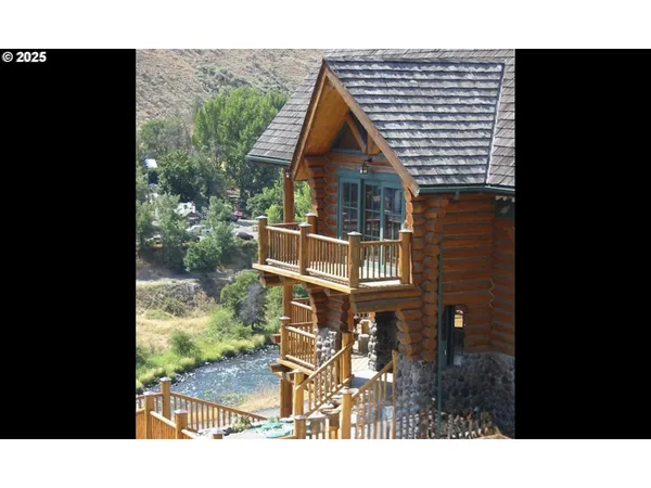 a balcony with furniture and potted plants