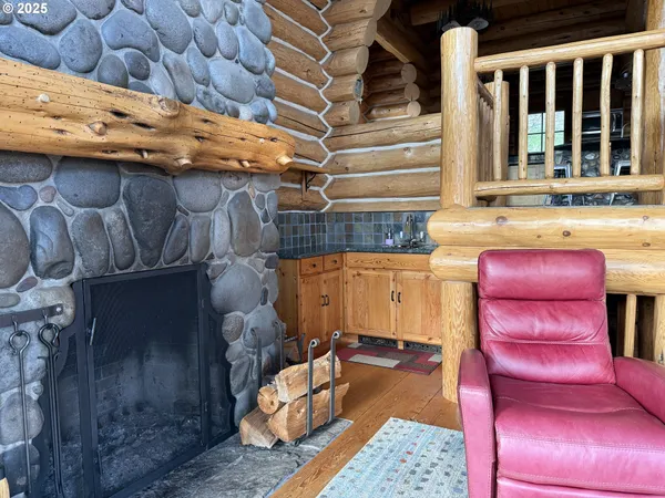 a view of a room with a table and chairs
