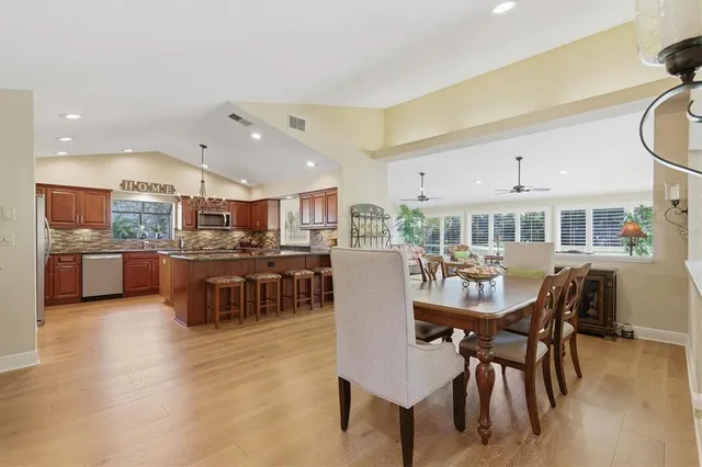 a utility room with cabinets washer and dryer