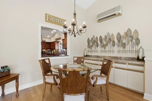 a bath tub sitting next to a white sink and vanity