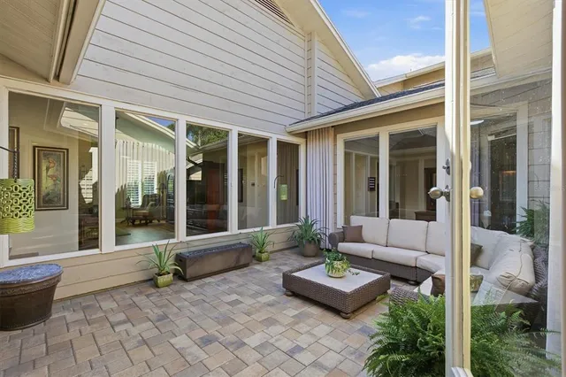 a view of a swimming pool with an outdoor seating