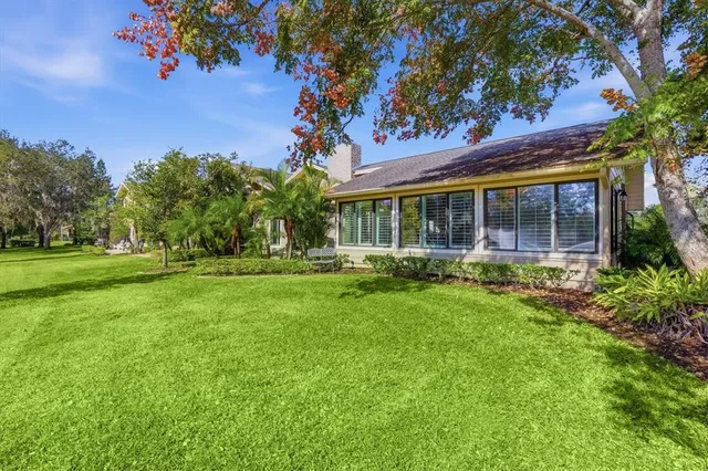 a street sign in front of flowers