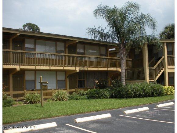 1708 Elm Street, Unit 8 Rockledge, FL 32955 - Photo 1 of 9 a front view of a house with a garden