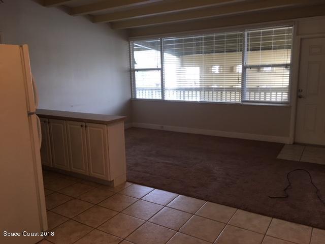 1708 Elm Street, Unit 8 Rockledge, FL 32955 - Photo 4 of 9 a view of an empty room and window