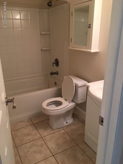 1708 Elm Street, Unit 8 Rockledge, FL 32955 - Photo 6 of 9 a bathroom with a toilet a sink and bathtub