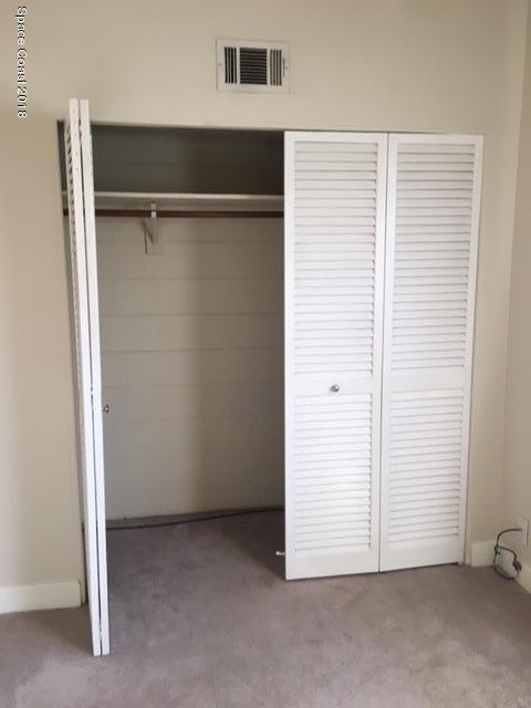 1708 Elm Street, Unit 8 Rockledge, FL 32955 - Photo 8 of 9 an empty room with closet