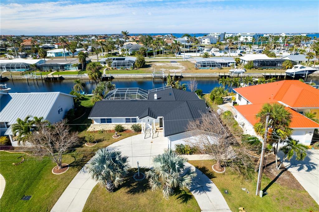 1732 Boca Raton Court Punta Gorda, FL 33950 - Photo 8 of 64 an aerial view of a house with a lake view