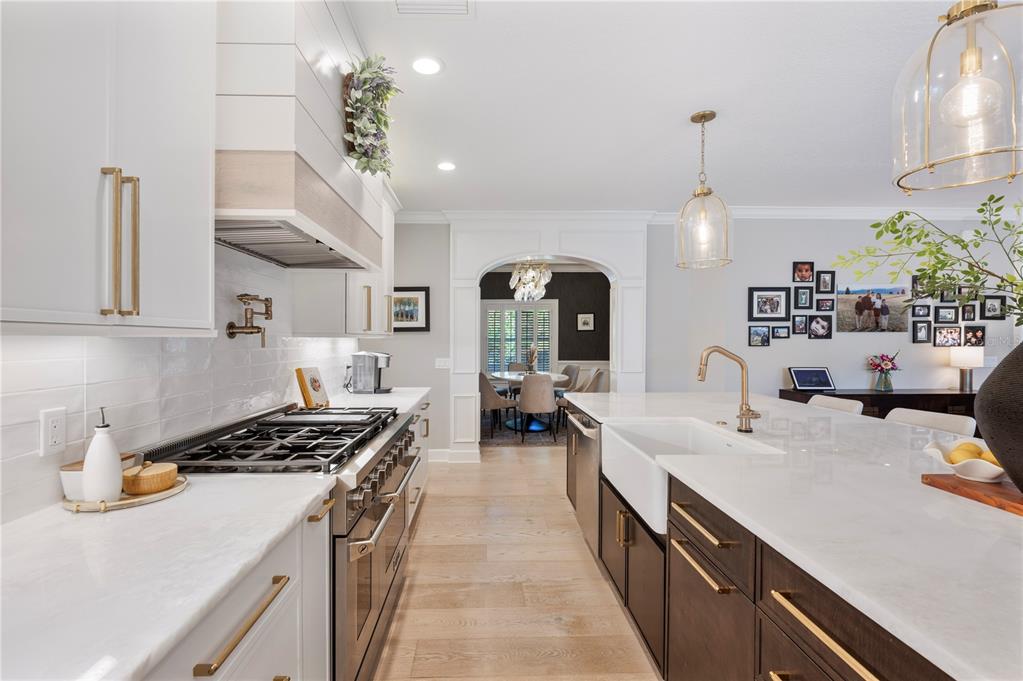 1909 New Jersey Road Lakeland, FL 33803 - Photo 23 of 93 a kitchen with stove a sink and cabinets