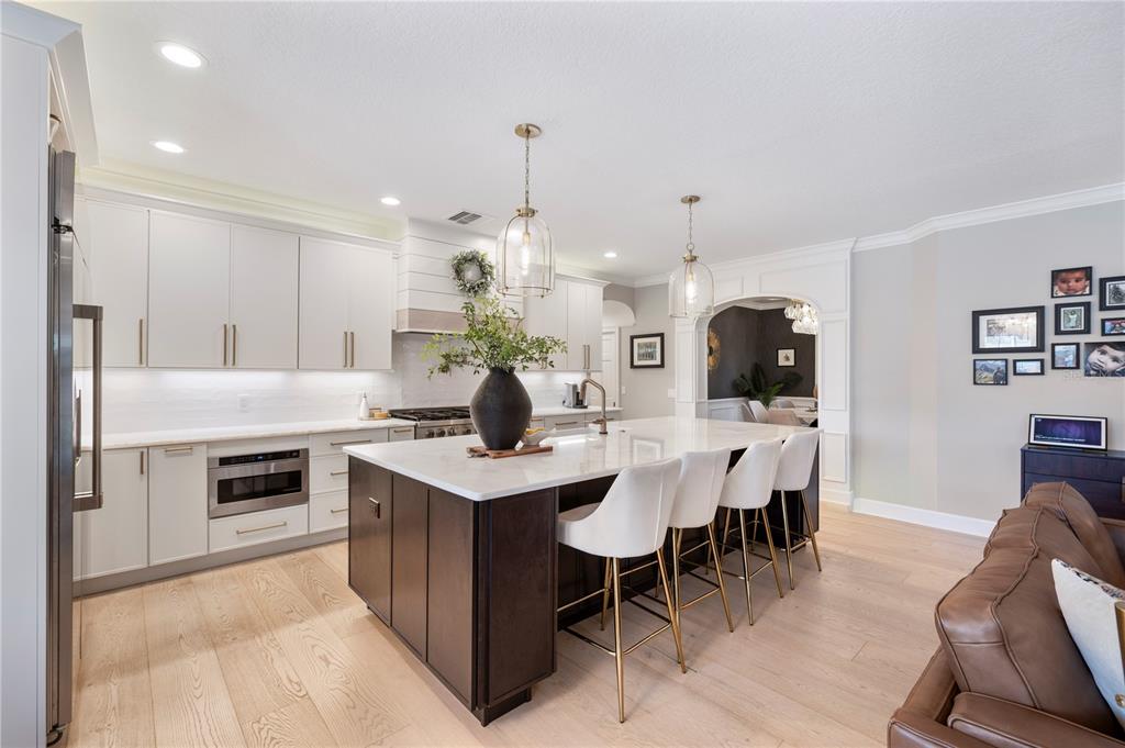 1909 New Jersey Road Lakeland, FL 33803 - Photo 28 of 93 a kitchen with kitchen island a dining table chairs stainless steel appliances and cabinets