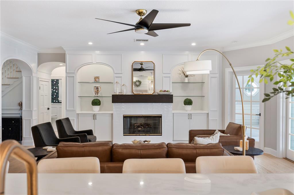 1909 New Jersey Road Lakeland, FL 33803 - Photo 35 of 93 a living room with furniture fireplace and a chandelier