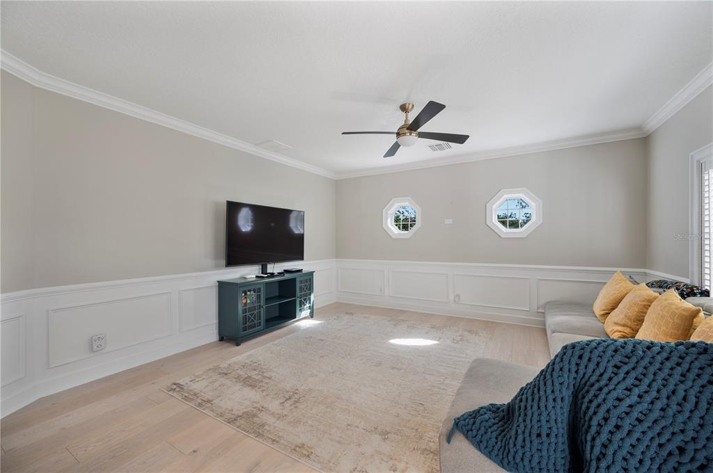 1909 New Jersey Road Lakeland, FL 33803 - Photo 38 of 93 a living room with a couch and a flat screen tv