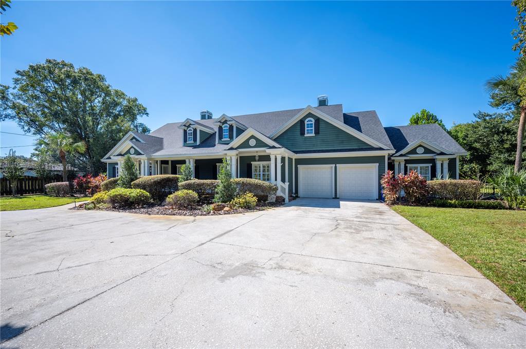 1909 New Jersey Road Lakeland, FL 33803 - Photo 4 of 93 a front view of a house with a yard and garage