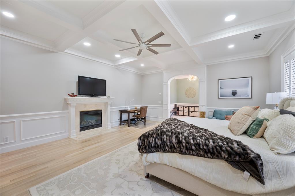 1909 New Jersey Road Lakeland, FL 33803 - Photo 44 of 93 a bedroom with a large bed and a fireplace