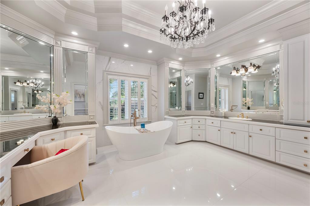 1909 New Jersey Road Lakeland, FL 33803 - Photo 46 of 93 a large white bathroom with a large tub sink shower and mirror