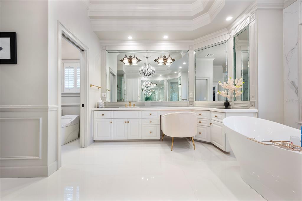 1909 New Jersey Road Lakeland, FL 33803 - Photo 51 of 93 a large white bathroom with a large tub sink and window