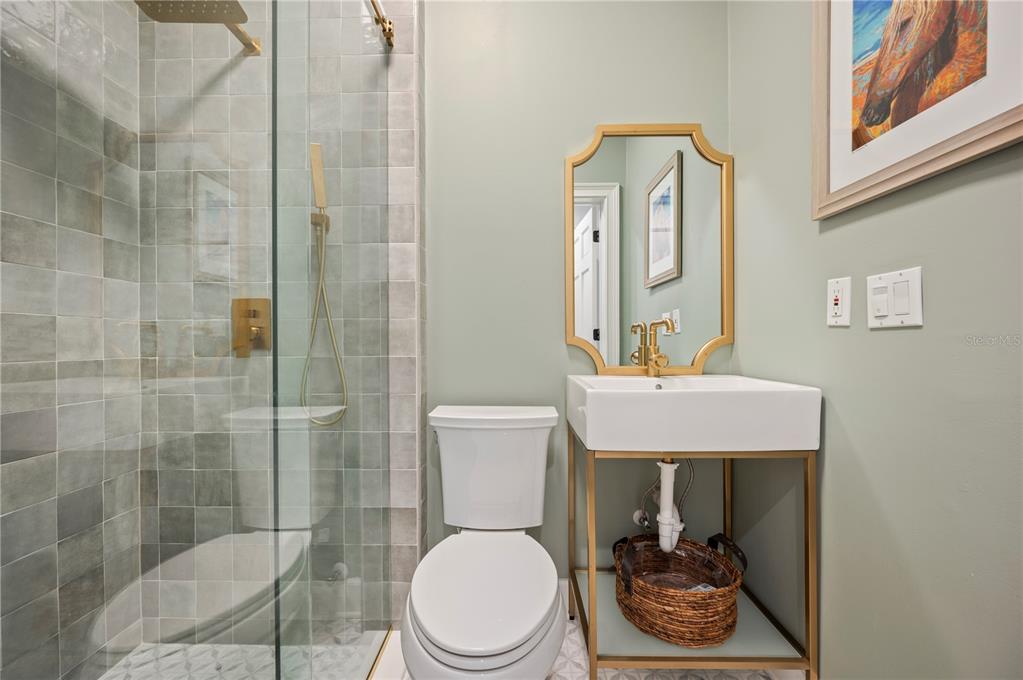 1909 New Jersey Road Lakeland, FL 33803 - Photo 54 of 93 a bathroom with a toilet a sink and shower