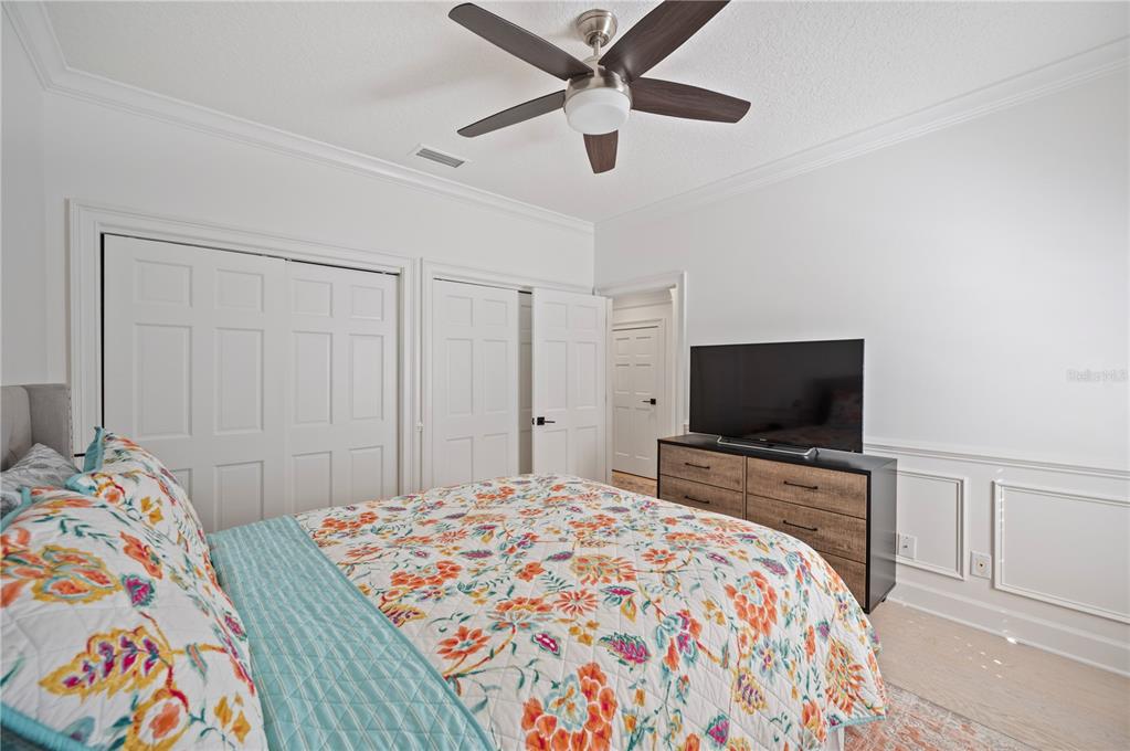 1909 New Jersey Road Lakeland, FL 33803 - Photo 58 of 93 a bedroom with a bed and a flat screen tv