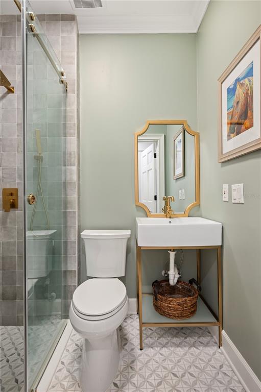 1909 New Jersey Road Lakeland, FL 33803 - Photo 58 of 93 a bathroom with a sink a toilet and shower