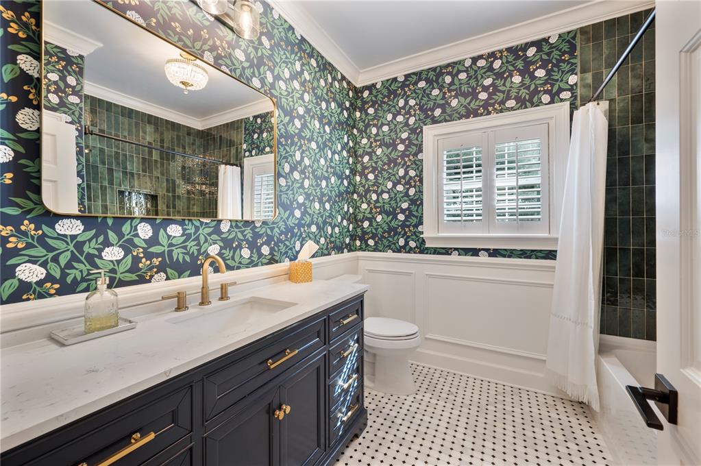 1909 New Jersey Road Lakeland, FL 33803 - Photo 61 of 93 a bathroom with a sink a toilet and shower