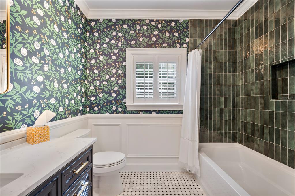 1909 New Jersey Road Lakeland, FL 33803 - Photo 62 of 93 a bathroom with a sink a toilet and shower