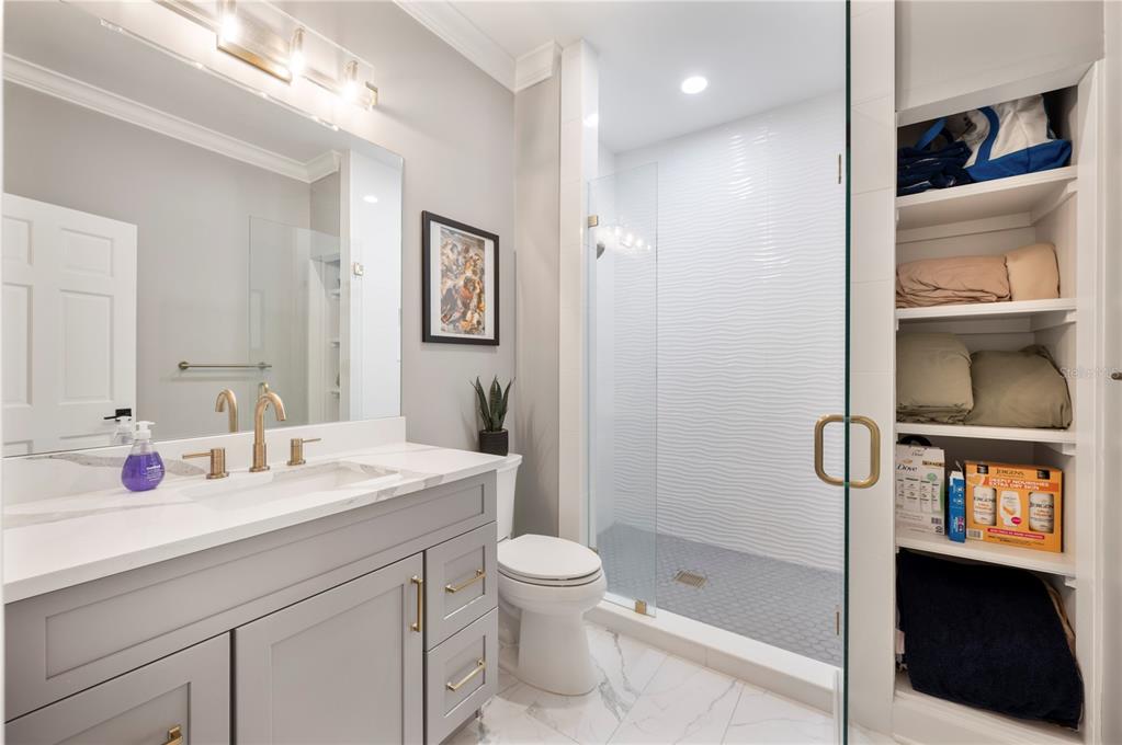 1909 New Jersey Road Lakeland, FL 33803 - Photo 65 of 93 a bathroom with a sink a toilet and shower