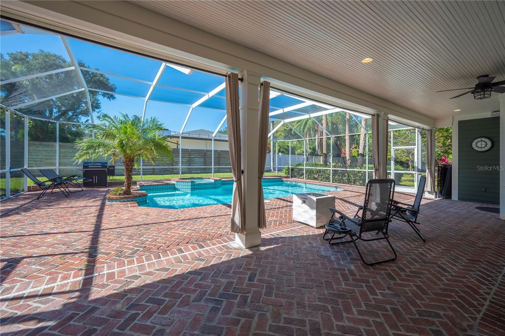 1909 New Jersey Road Lakeland, FL 33803 - Photo 74 of 93 a view of a porch with chairs and backyard
