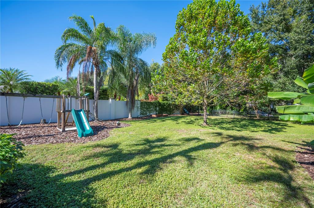 1909 New Jersey Road Lakeland, FL 33803 - Photo 77 of 93 a garden with wooden fence