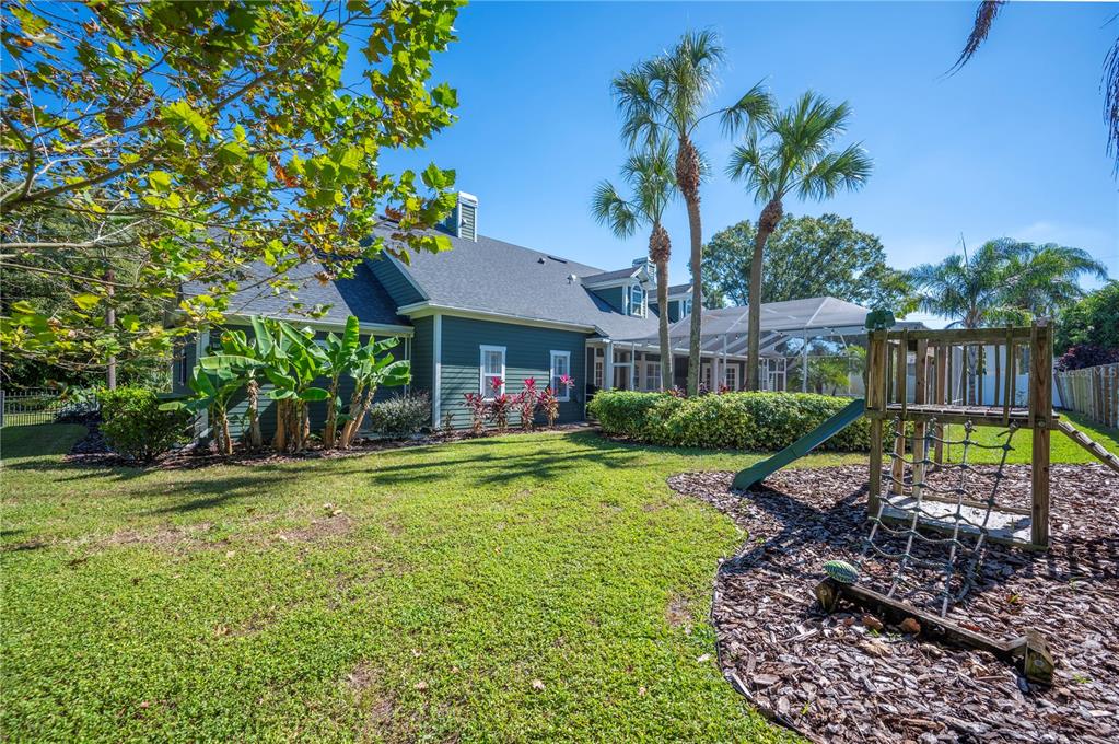 1909 New Jersey Road Lakeland, FL 33803 - Photo 77 of 93 a view of a house with a yard and potted plants