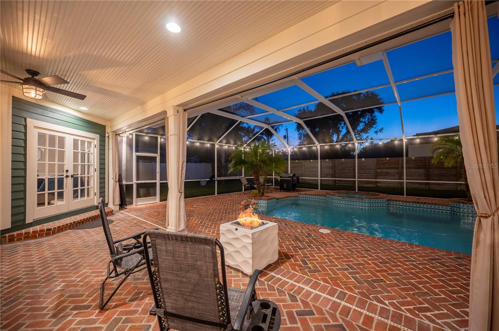 1909 New Jersey Road Lakeland, FL 33803 - Photo 86 of 93 a patio with yard glass top table and chairs