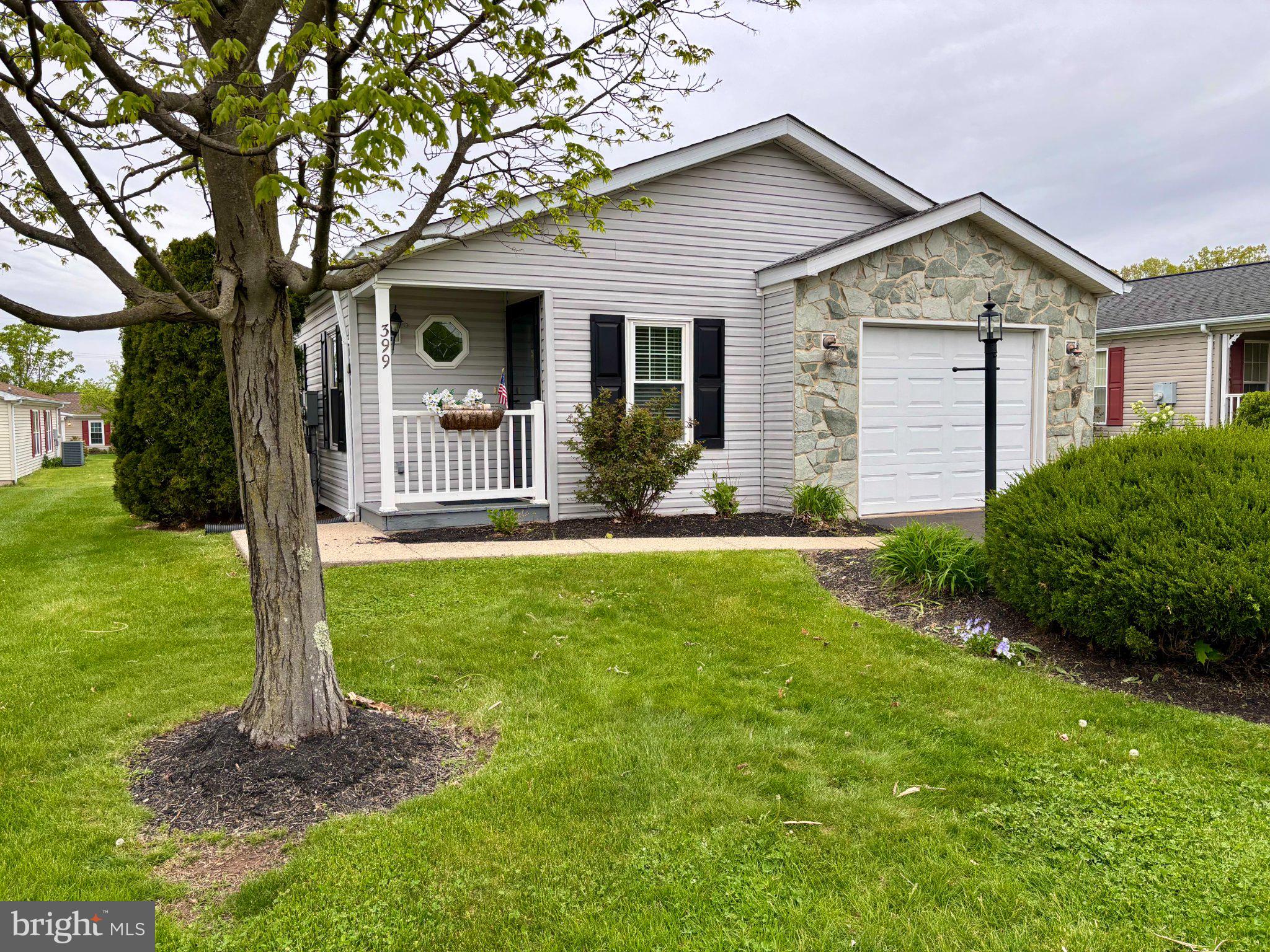 399 Spring Meadow Circle New Hope, PA 18938 - Photo 1 of 37 a front view of a house with garden