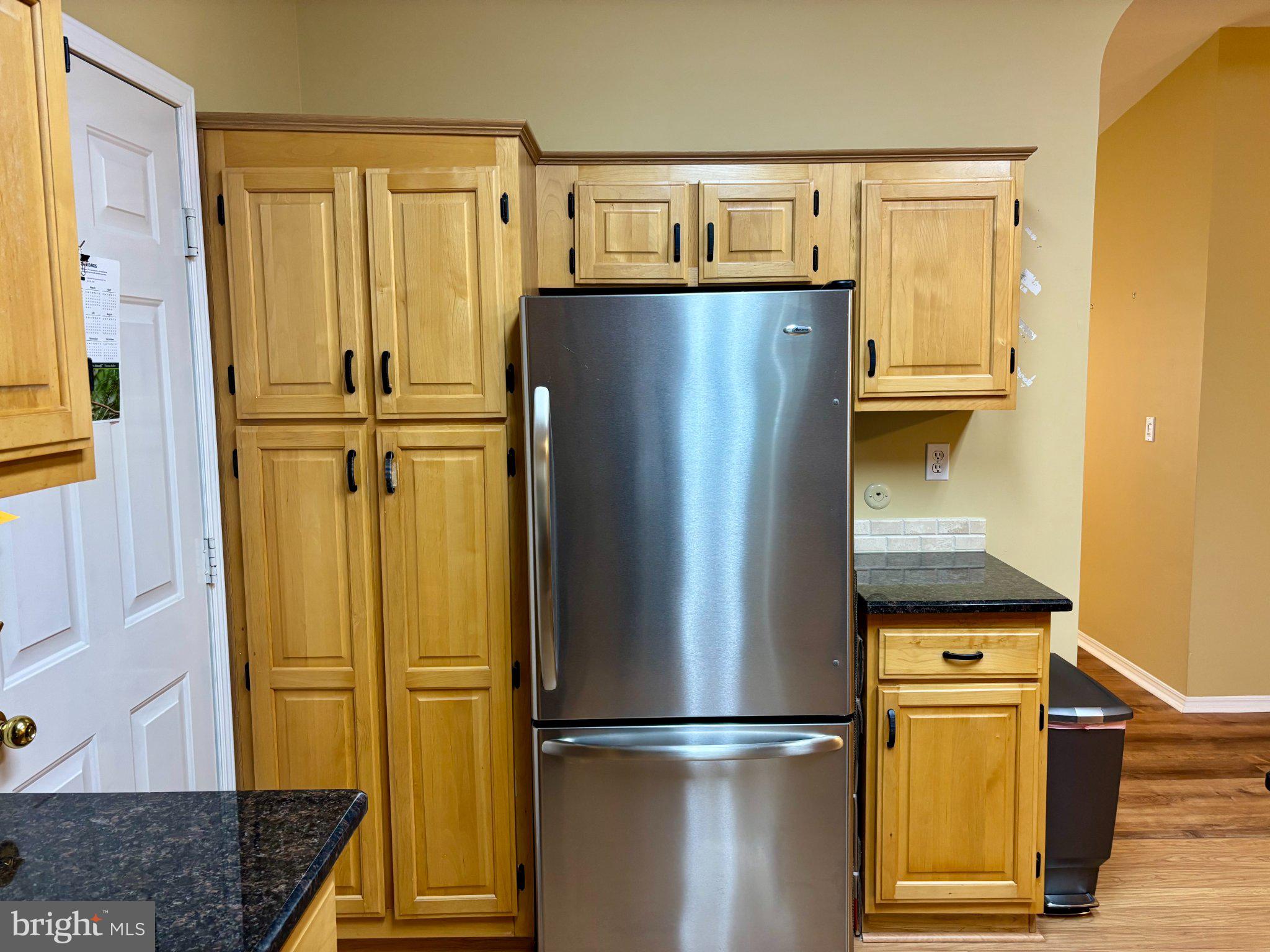 399 Spring Meadow Circle New Hope, PA 18938 - Photo 13 of 37 a kitchen with a refrigerator and cabinets
