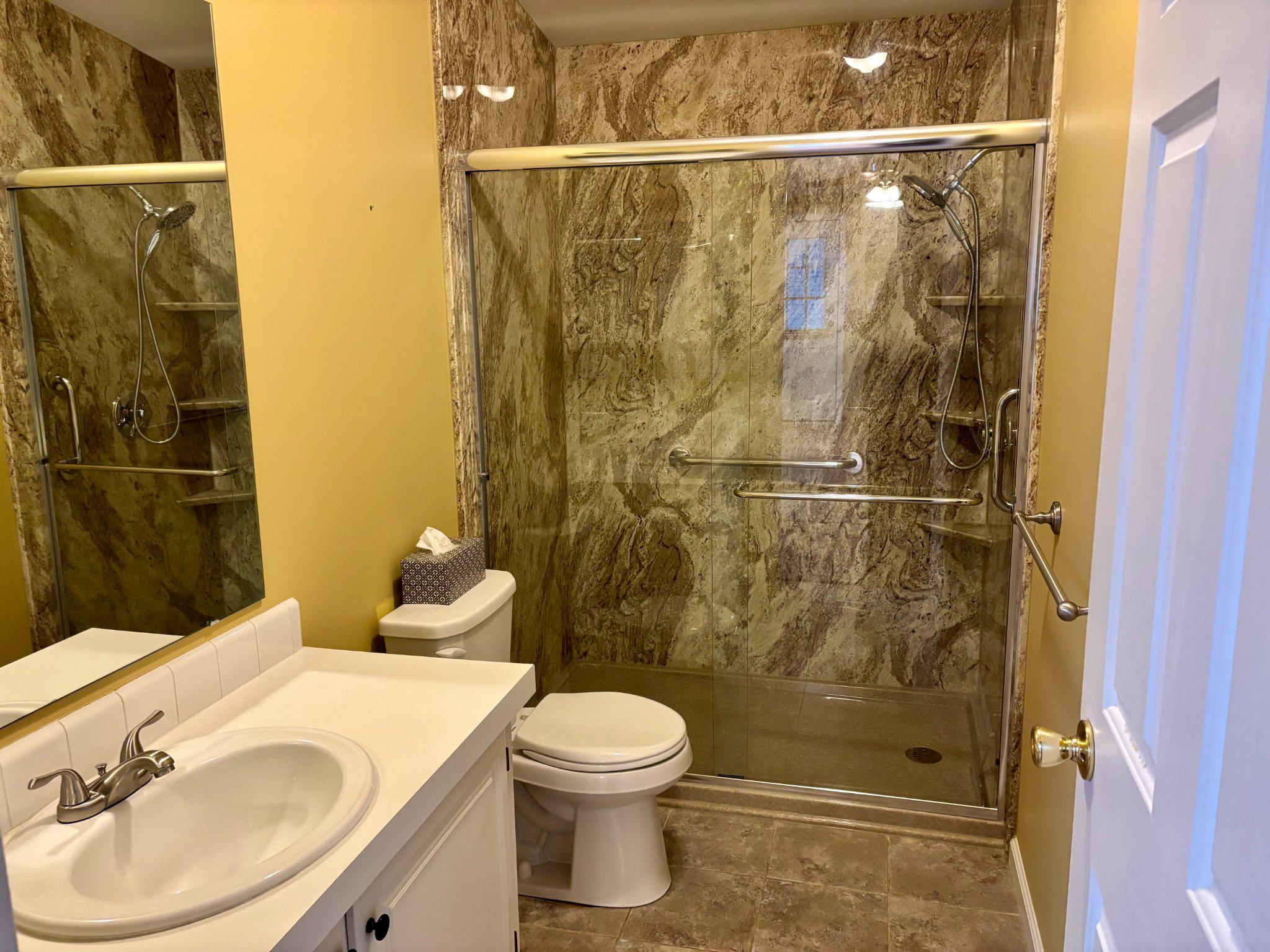 399 Spring Meadow Circle New Hope, PA 18938 - Photo 15 of 37 a bathroom with a sink a toilet and shower