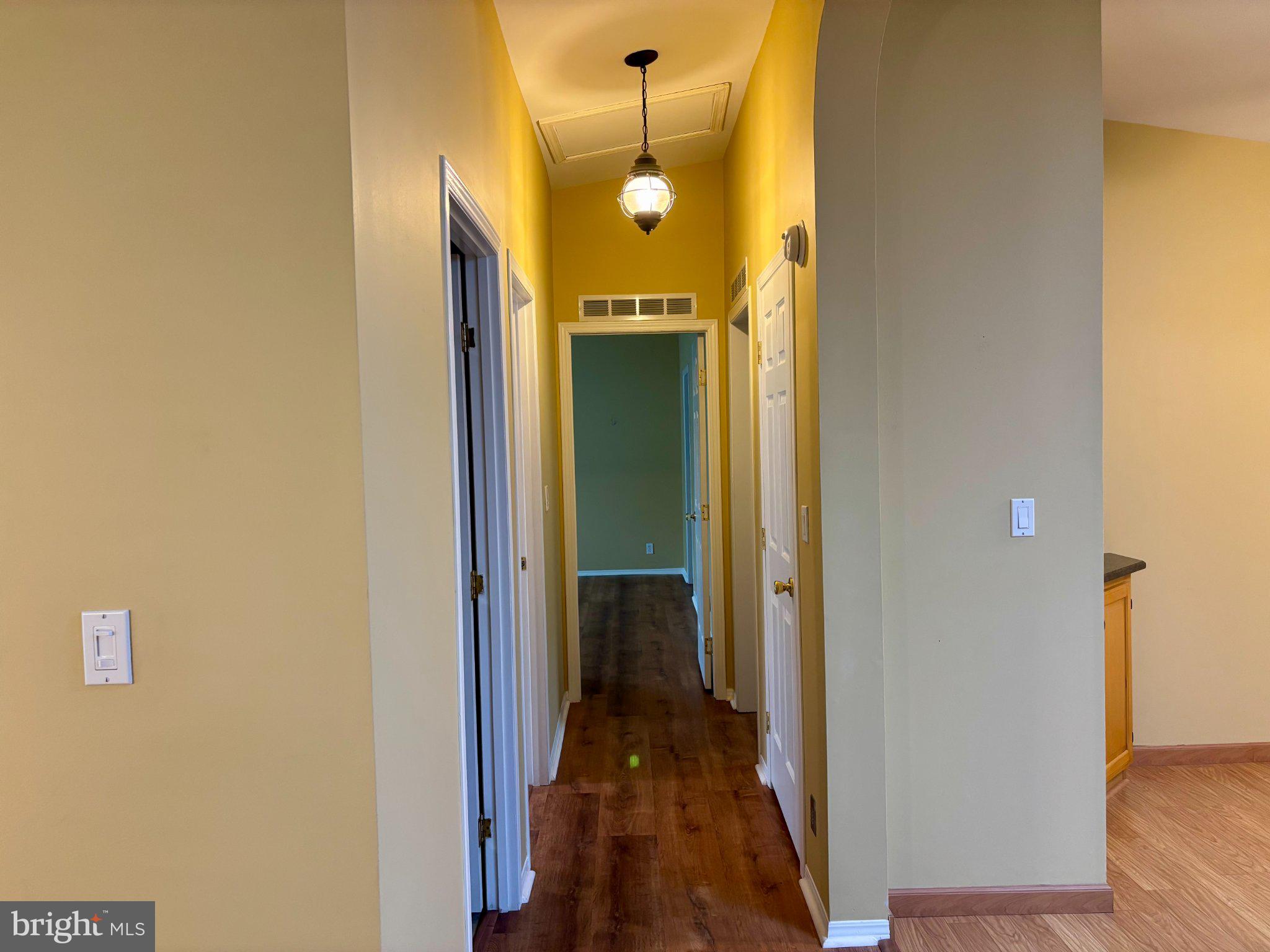 399 Spring Meadow Circle New Hope, PA 18938 - Photo 17 of 37 a view of a hallway with wooden floor