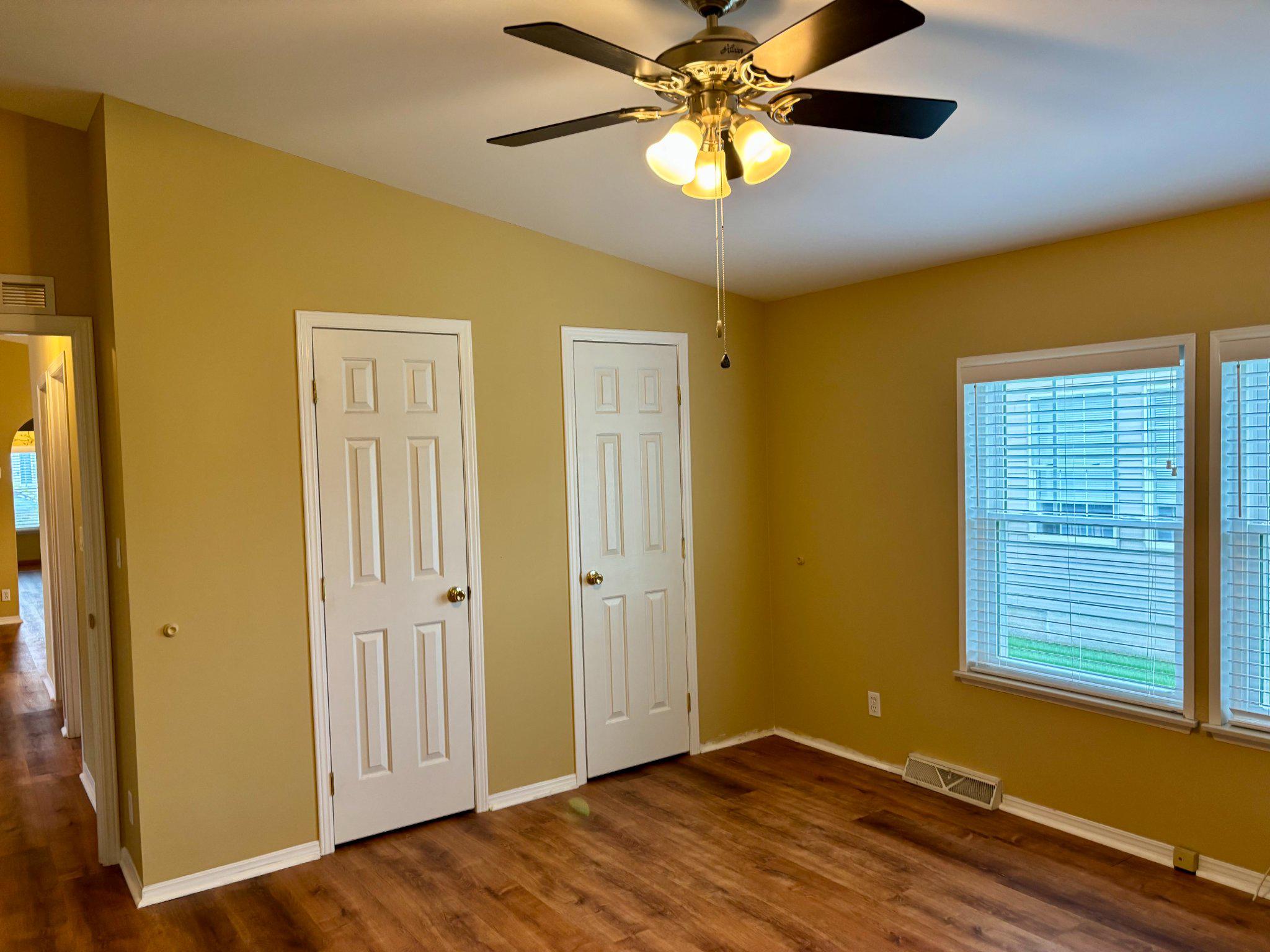 399 Spring Meadow Circle New Hope, PA 18938 - Photo 20 of 37 a view of an empty room with a window and wooden floor