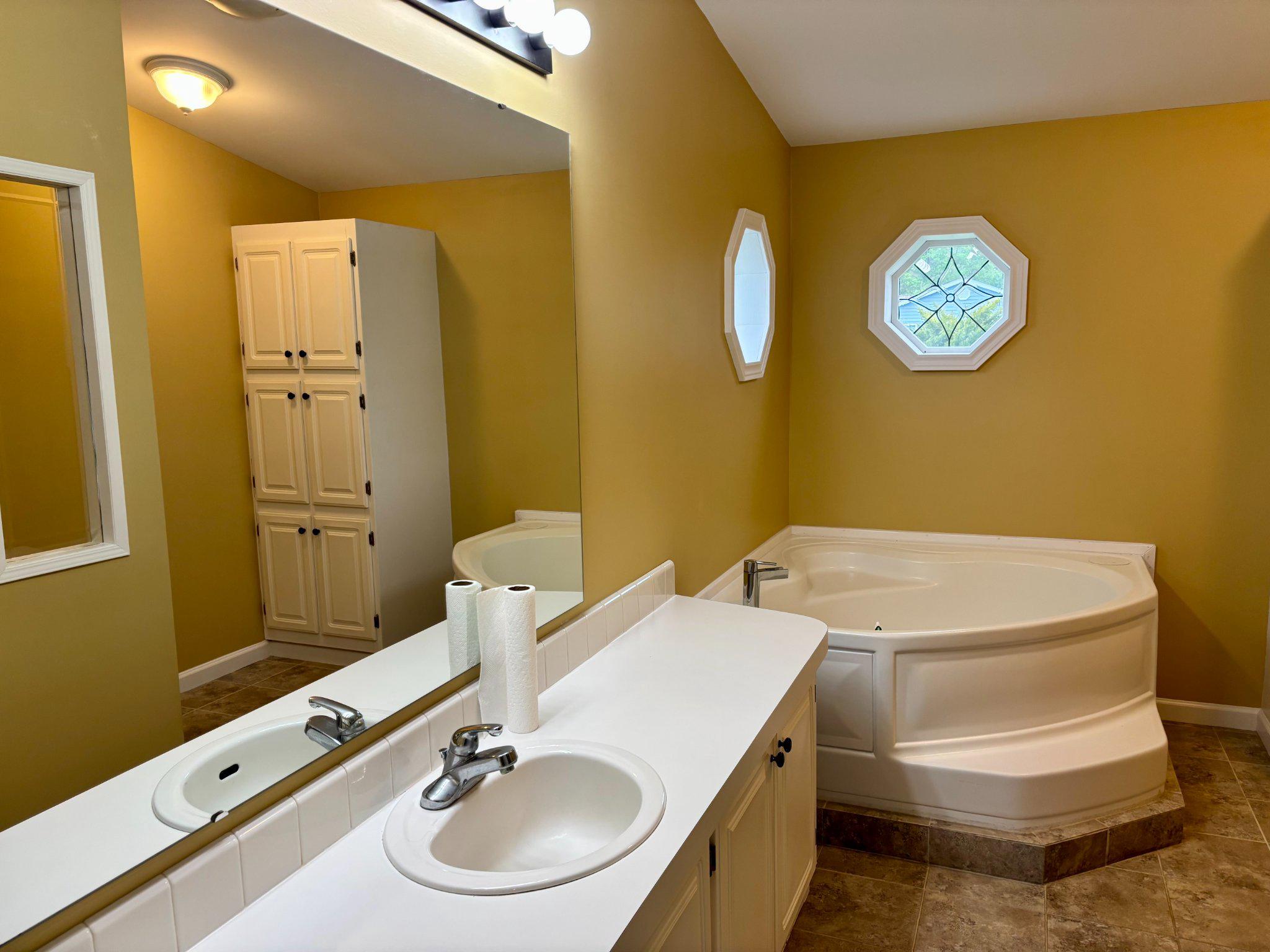 399 Spring Meadow Circle New Hope, PA 18938 - Photo 21 of 37 a bathroom with a sink and a mirror