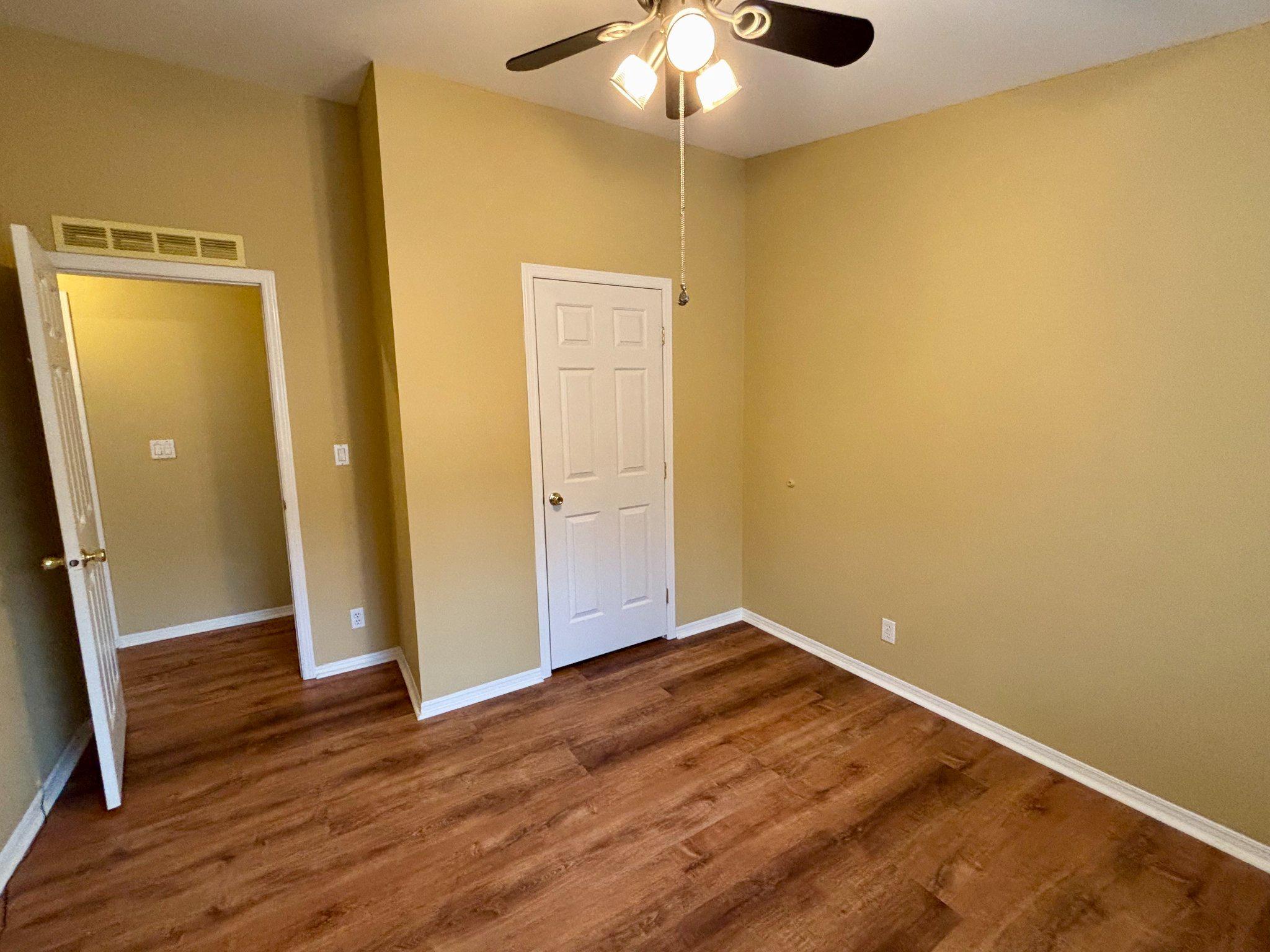 399 Spring Meadow Circle New Hope, PA 18938 - Photo 25 of 37 an empty room with wooden floor and entrance