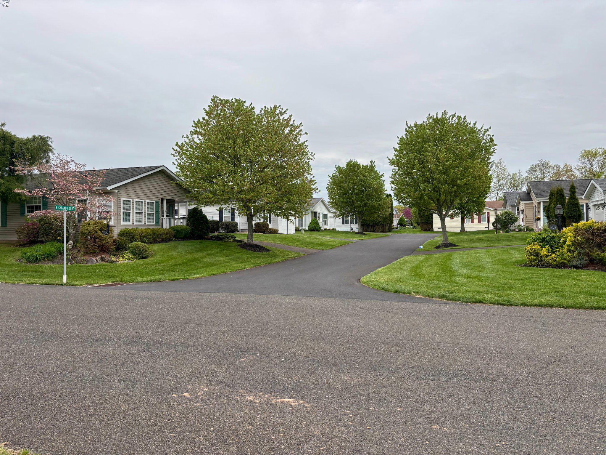 399 Spring Meadow Circle New Hope, PA 18938 - Photo 31 of 37 a view of a house with a big yard and palm trees