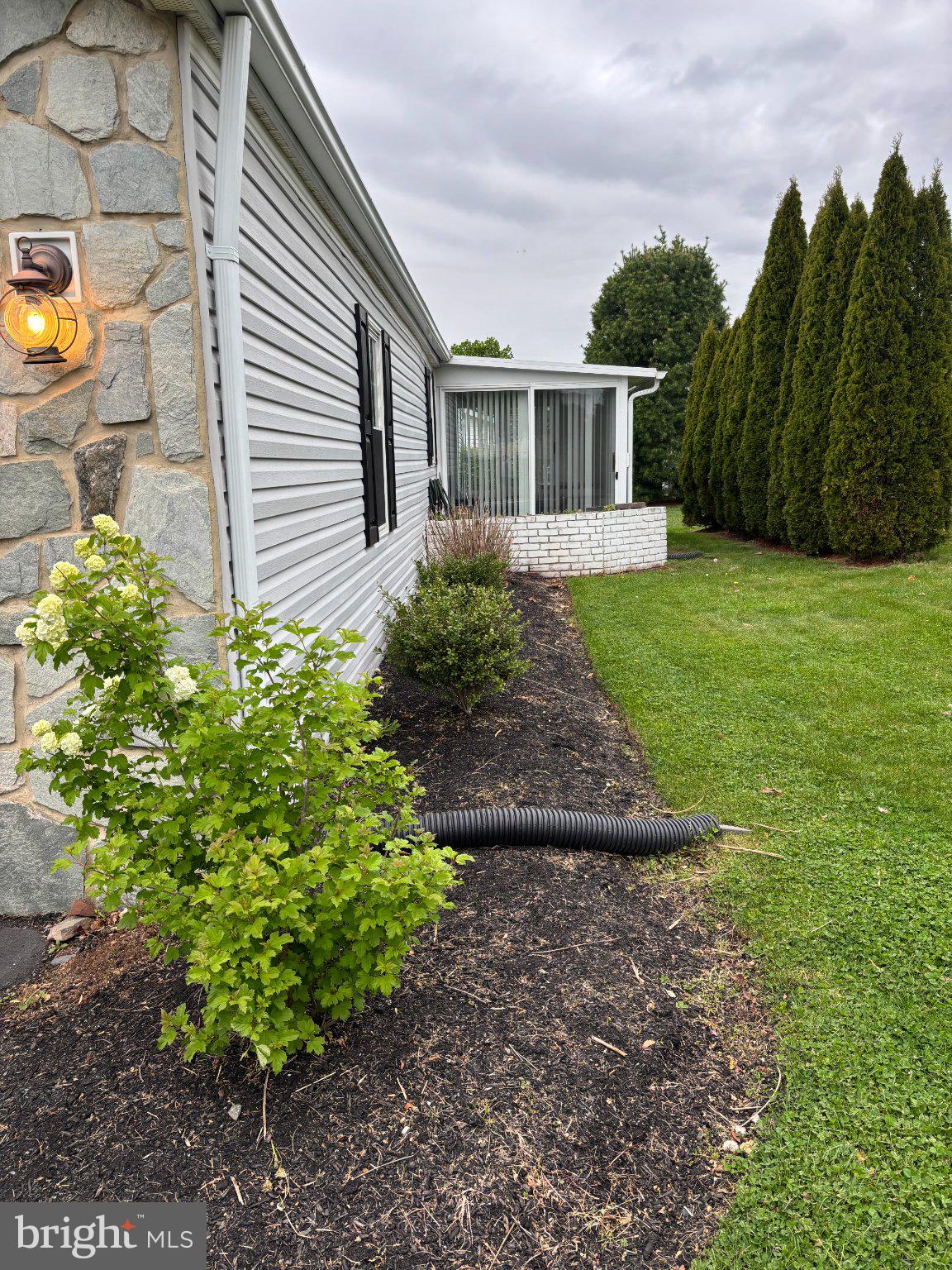 399 Spring Meadow Circle New Hope, PA 18938 - Photo 5 of 37 a view of a house with backyard and garden