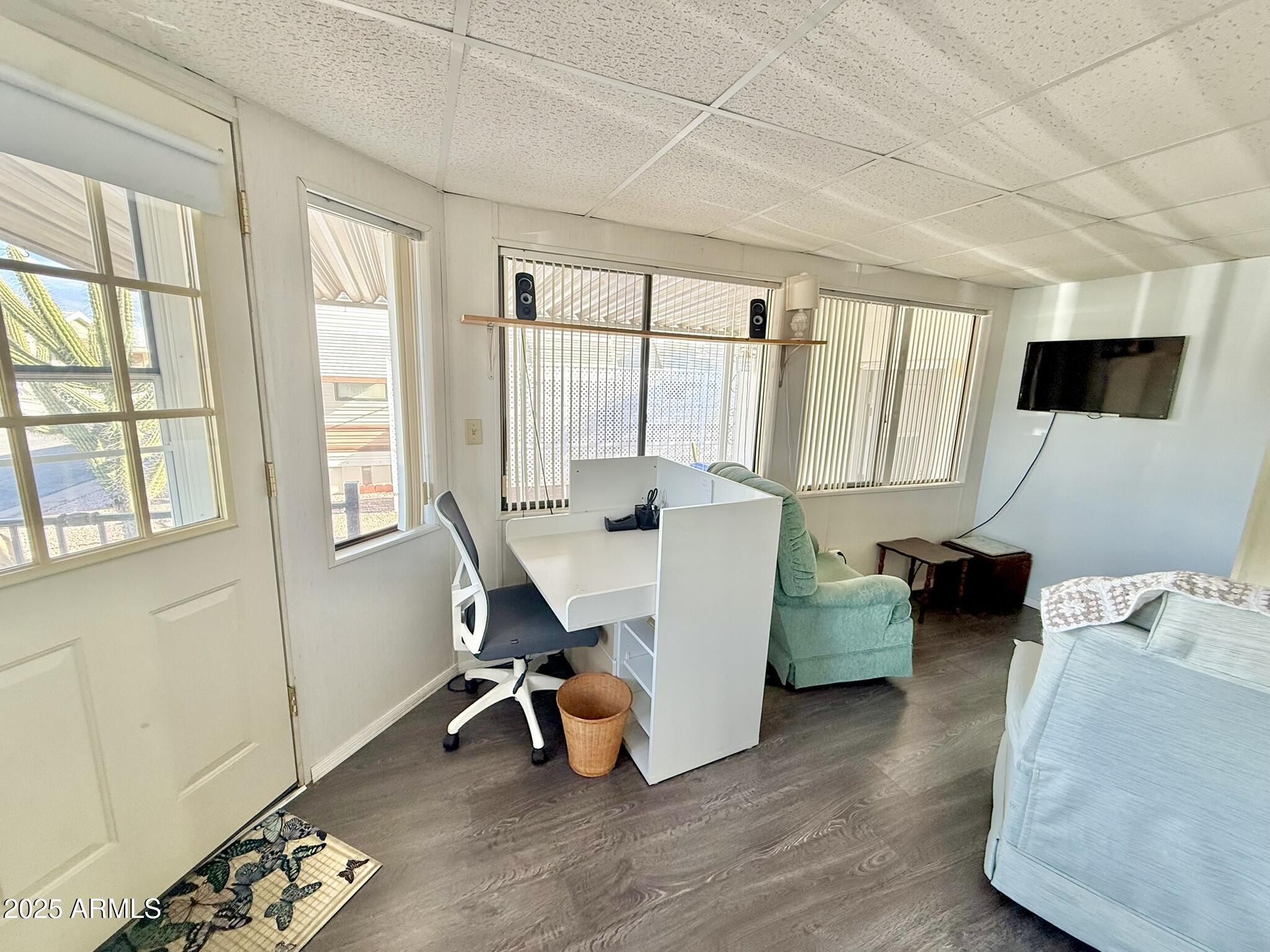 8865 East Baseline Road, Unit 1643 Mesa, AZ 85209 - Photo 13 of 44 a view of a livingroom with workspace and a window