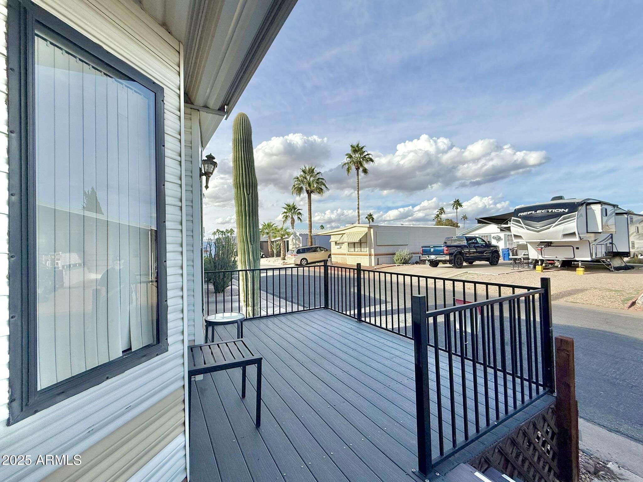 8865 East Baseline Road, Unit 1643 Mesa, AZ 85209 - Photo 23 of 44 a view of a balcony with wooden floor